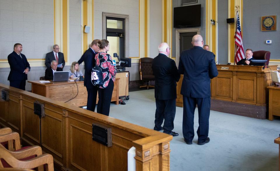 Kayla Artressia, 32, left, and Phil Malone, 64, stand with their attorneys in front of Scioto County Common Pleas Judge Howard Harcha August 22, 2019, for their arraignment on felony forgery and other charges stemming from Malone allegedly falsifying documents as a notary public for Artressia. Both were released on bond.  Artressia has alleged a long sexual history with Malone dating back to when she was 15 and he 51. Malone is a former former Scioto County Sheriff's dispatcher and former probation officer. He was fired from both jobs. Several women have come forward accusing Malone of sexual misconduct. He denies all allegations. Rumors have long circulated in the small city of Portsmouth about men in power taking advantage of vulnerable women. Michael Mearan, prominent Portsmouth attorney, is part of an 80-page affidavit created by the Drug Enforcement Administration in 2015 to obtain permission to wiretap several phone, including Mearan's. It alleges he is part of a sex trafficking network.
