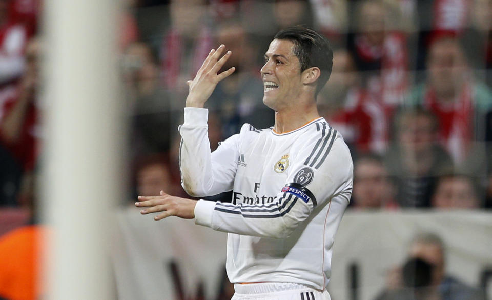 Real's Cristiano Ronaldo celebrates scoring his side's 3rd goal during the Champions League semifinal second leg soccer match between Bayern Munich and Real Madrid at the Allianz Arena in Munich, southern Germany, Tuesday, April 29, 2014. (AP Photo/Matthias Schrader)