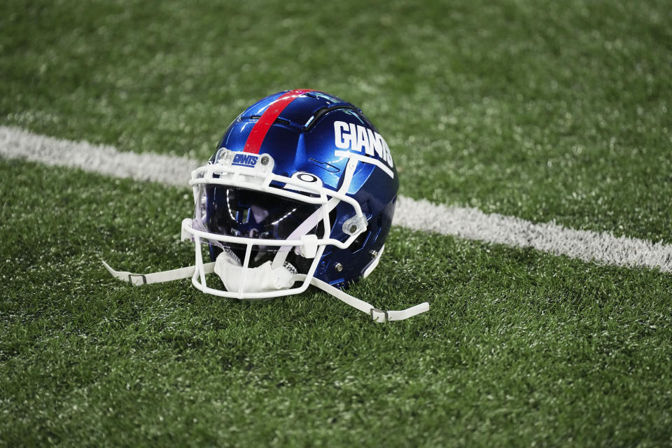 EAST RUTHERFORD, NJ - SEPTEMBER 26: A New York Giants helmet sits on the turf against the Dallas Cowboys at MetLife Stadium on September 26, 2022 in East Rutherford, New Jersey. (Photo by Cooper Neill/Getty Images)