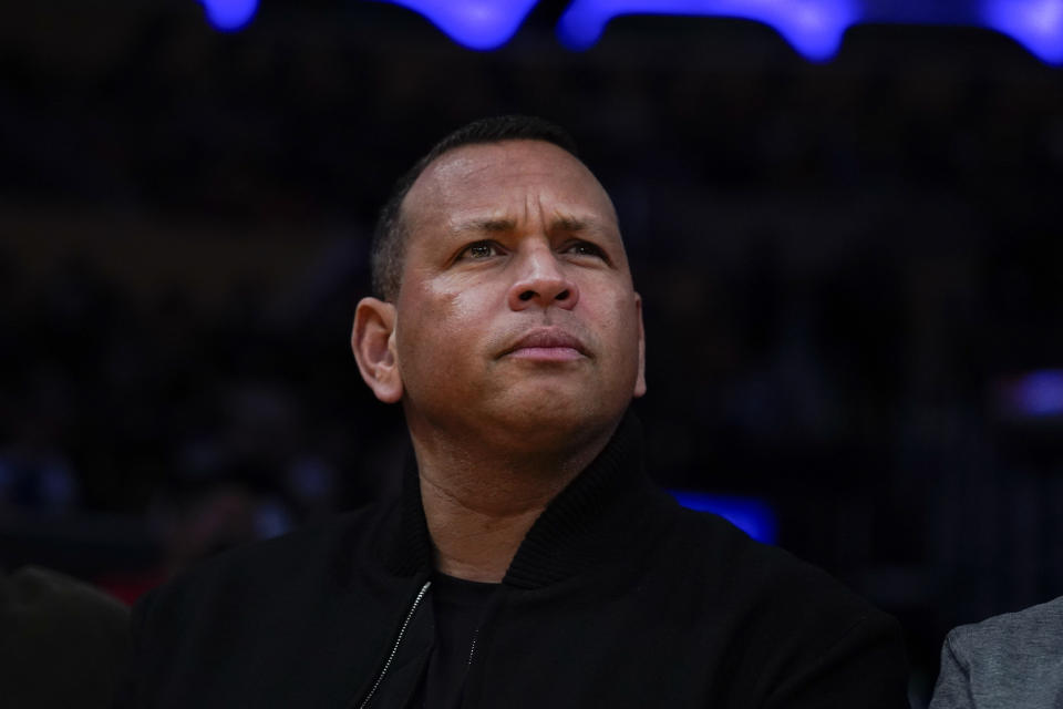 FILE - Minnesota Timberwolves co-owner and former New York Yankees slugger Alex Rodriguez attends an NBA basketball game between the Los Angeles Lakers and the Minnesota Timberwolves, Nov. 12, 2021, in Los Angeles. Rodriguez is a key part of an investment group seeking to buy the rights to former President Donald Trump’s marquee Washington, D.C., hotel. (AP Photo/Jae C. Hong, file)