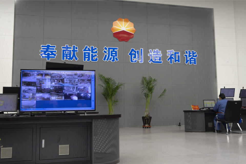 In this July 23, 2019, photo, a computer screen in the control room of the Fushun Petrochemical Company shows surveillance video from olefin production facilities in Fushun in northeastern China's Liaoning Province. Authorities in China's rust-belt region are looking for support for its revival from Beijing's multibillion-dollar initiative to build ports, railways and other projects abroad. (AP Photo/Olivia Zhang)