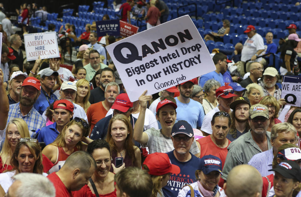 Trump supporters displaying QAnon posters appeared at President Donald J. Trump's Make America Great Again rally in 2018 at the Florida State Fair Grounds in Tampa Florida.  (Photo: Thomas O'Neill/NurPhoto via Getty Images)