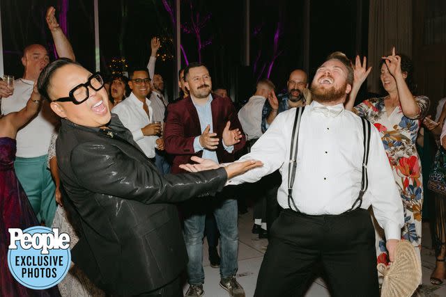 <p>Logan Cole Photography</p> Nico Santos (left) and Zeke Smith dance at their wedding.