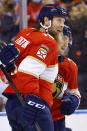 Florida Panthers left wing Frank Vatrano (77) celebrates with center Joe Thornton (19) after scoring a goal against the Arizona Coyotes during the second period of an NHL hockey game, Monday, Oct. 25, 2021, in Sunrise, Fla. (AP Photo/Michael Reaves)