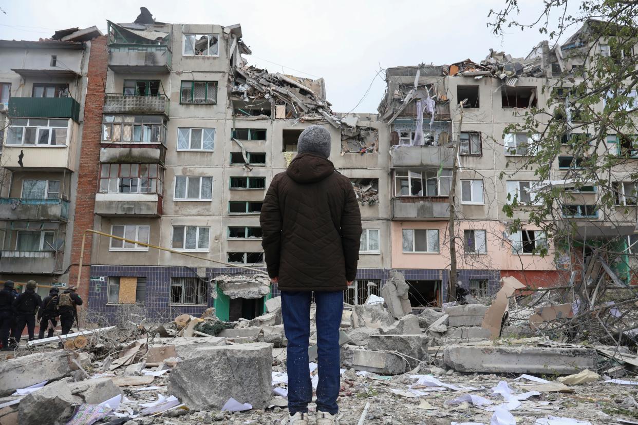 A local resident looks at his home, damaged in today Russian rocket attack in Sloviansk, Donetsk region, Ukraine (AP)