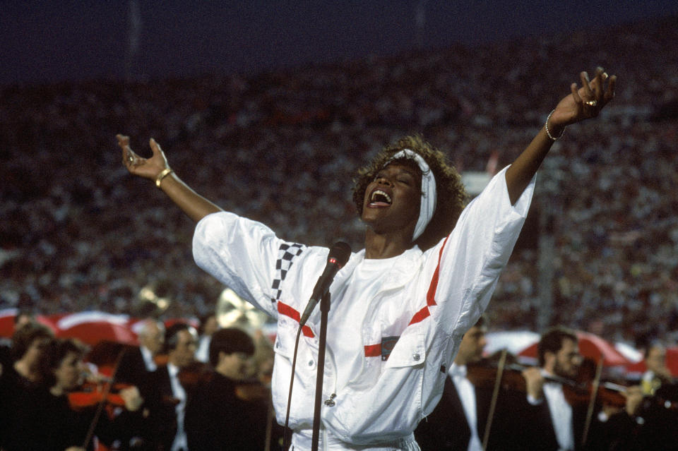 TAMPA, FL - JANUARY 27: Whitney Houston sings the National Anthem before a game with the New York Giants taking on the Buffalo Bills prior to Super Bowl XXV at Tampa Stadium on January 27, 1991 in Tampa, Florida. The Giants won 20-19. (Photo by George Rose/Getty Images)