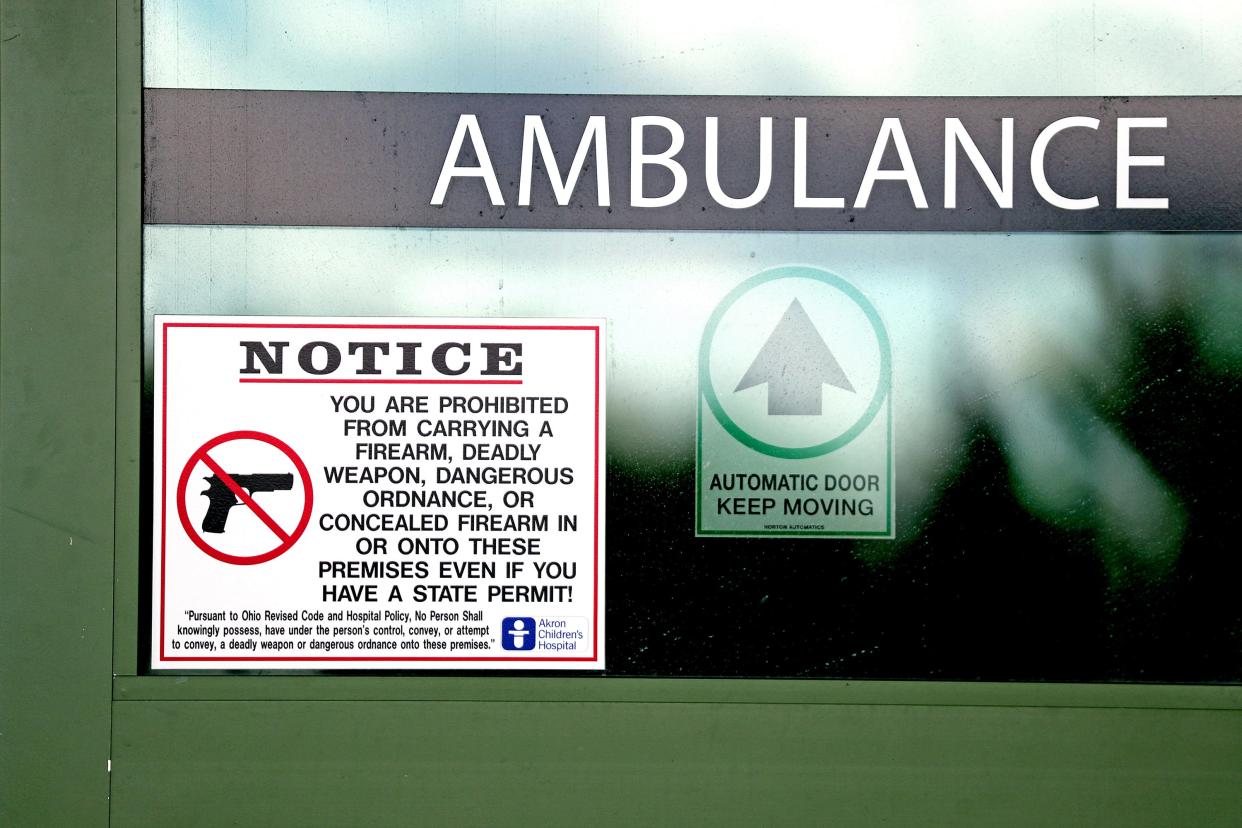 A notice on the ambulance bay door lets visitors and patients know that Akron Children's Hospital is a gun-free zone.