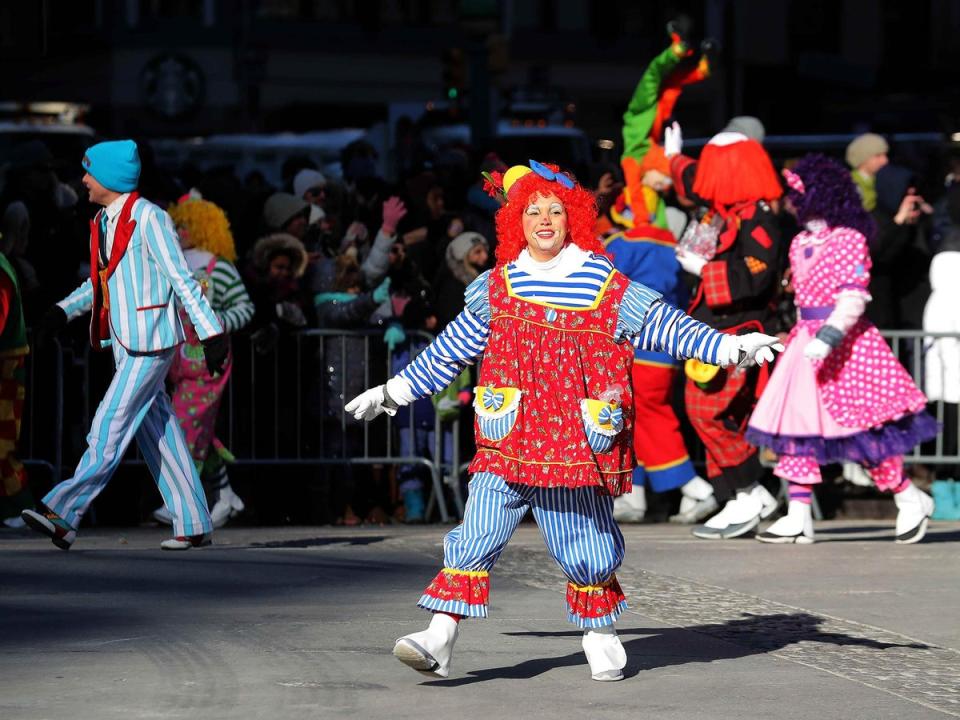 A clown performs in the parade (Reuters)