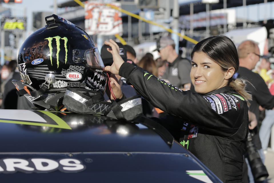 Driver Hailie Deegan prepares her helmet before the start of the ARCA auto race at Daytona International Speedway, Saturday, Feb. 8, 2020, in Daytona Beach, Fla. (AP Photo/Terry Renna)