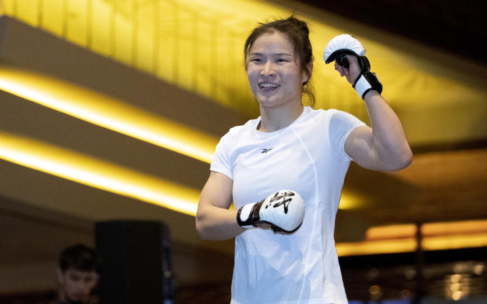 UFC women's strawweight champion Zhang Weili, of China, smiles during open workouts for UFC 248, in Las Vegas on Wednesday, March 4, 2020. Zhang is scheduled to defend her title against former champion Joanna Jedrzejczyk on Saturday in Las Vegas. (Steve Marcus/Las Vegas Sun via AP)