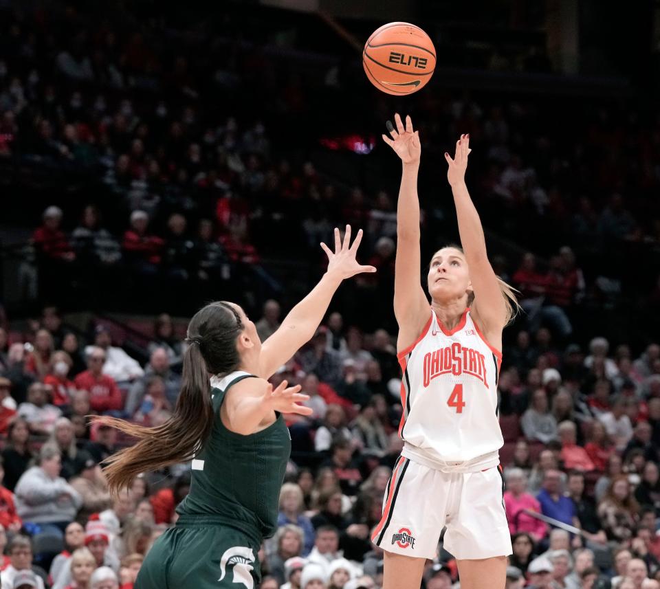 Ohio State guard Jacy Sheldon is guarded by Michigan State's Abbey Kimball during the first quarter of the Buckeyes' 70-65 win Sunday.