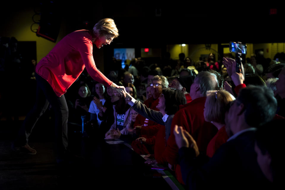 Democratic presidential candidate Sen. Elizabeth Warren, D-Mass., meets with attendees during a campaign event, Thursday, Feb. 6, 2020, in Derry, N.H. (AP Photo/Matt Rourke)