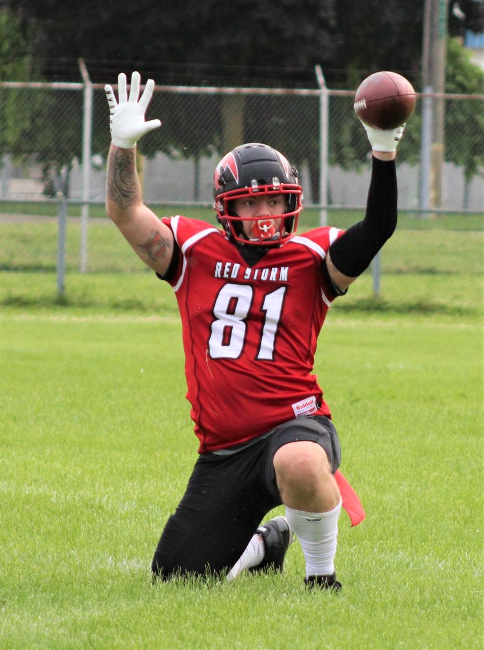 Southeast Michigan Red Storm tight end Tyler Hammack calls out that he made the catch before it hit the grass against the West Michigan Patriots on Saturday, June 11, 2022. Referees called the play incomplete.