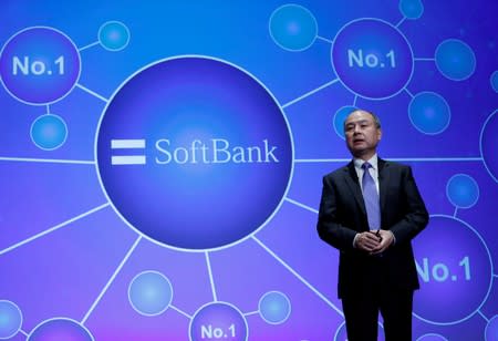 FILE PHOTO: Japan's SoftBank Group Corp Chief Executive Masayoshi Son attends a news conference in Tokyo