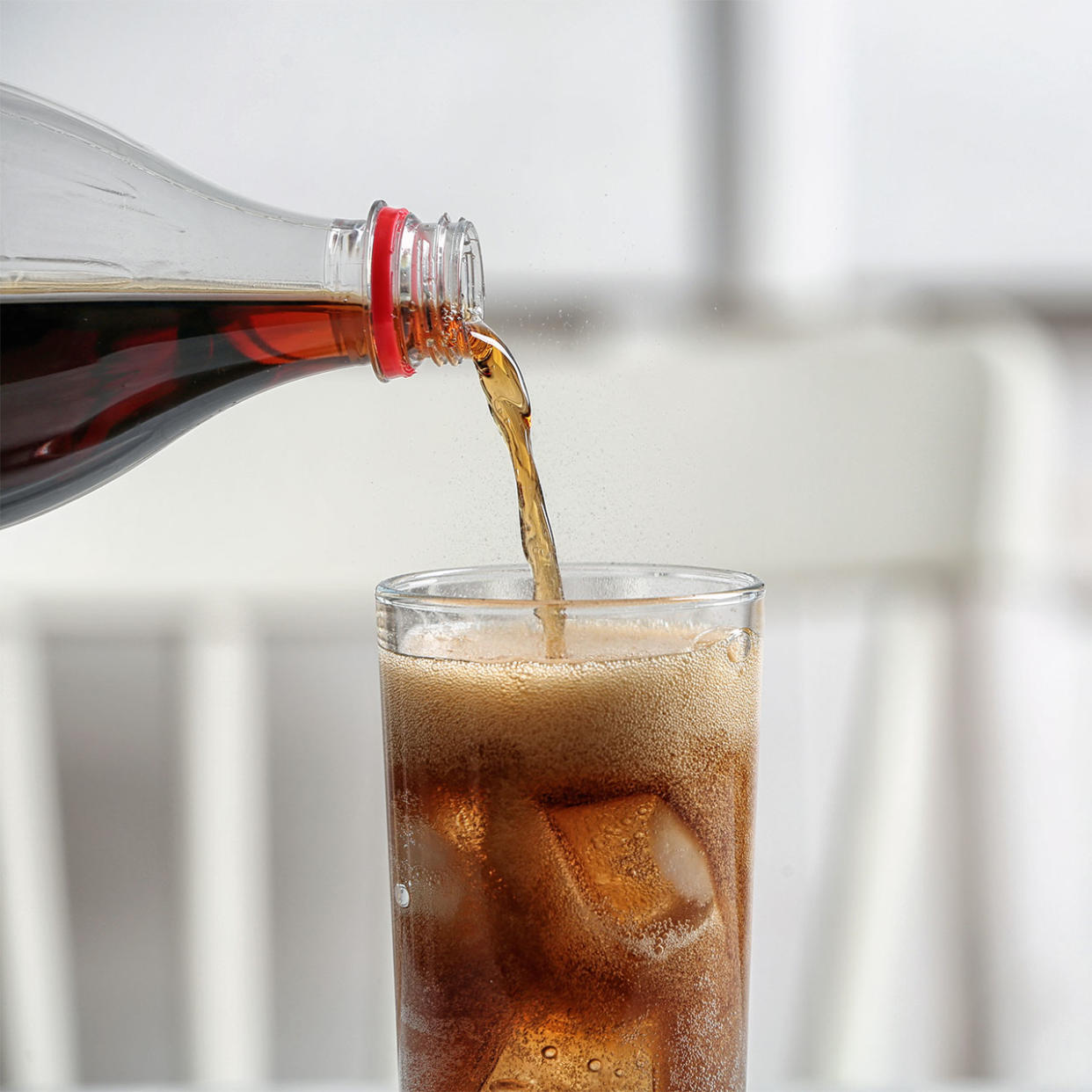 soda pouring into a glass