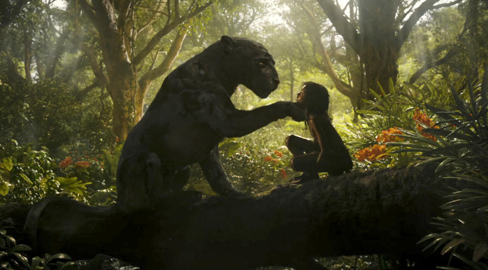 This image released by Netflix shows Rohan Chand as Mowgli, right, and the character Bagheera, voiced by Christian Bale, in a scene from the film, "Mowgli: Legend of the Jungle," streaming on Netflix on Friday. (Netflix via AP)
