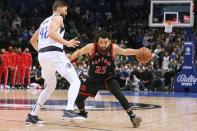 Toronto Raptors guard Fred VanVleet (23) tries to get around Dallas Mavericks forward Maxi Kleber (42) during the second half of an NBA basketball game in Dallas, Wednesday, Jan. 19, 2022. The Mavericks won 102-98. (AP Photo/LM Otero)