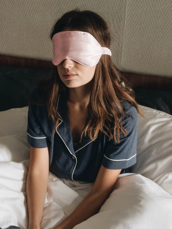 model wearing the sleep mask in pink