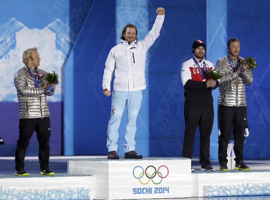 Men's super-G medalists, from left, the United States' Andrew Weibrecht, silver, Norway's Kjetil Jansrud, gold, and Canada's Jan Hudec and the United States' Bode Miller, who tied for the bronze, pose with their medals at the 2014 Winter Olympics in Sochi, Russia, Sunday, Feb. 16, 2014. (AP Photo/Morry Gash)