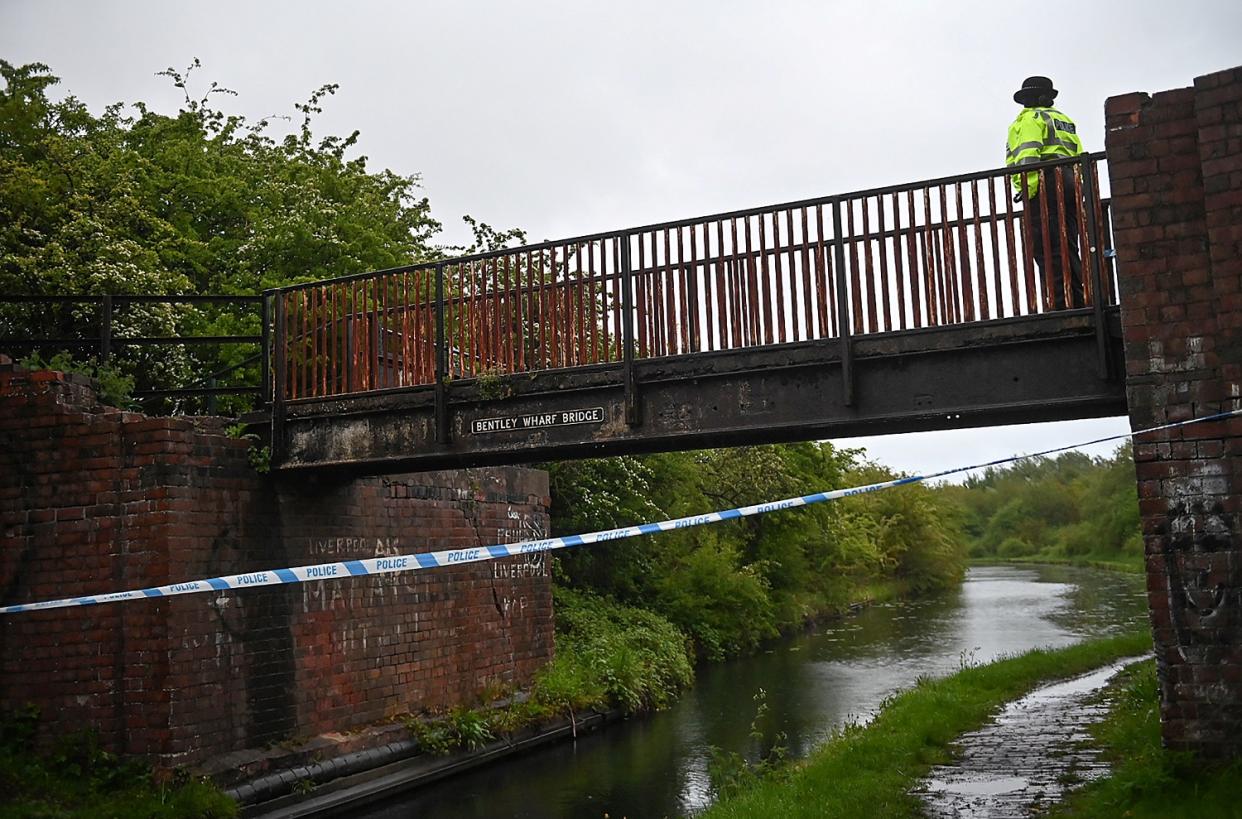 A passer-by was crossing the bridge when he spotted the body in the water (swns)