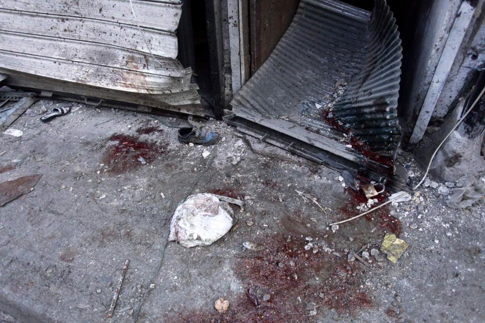 Blood stains the floor at a damaged site after what activists said was an air strike from forces loyal to Syria's President Bashar al-Assad in Takeek Al-Bab area of Aleppo