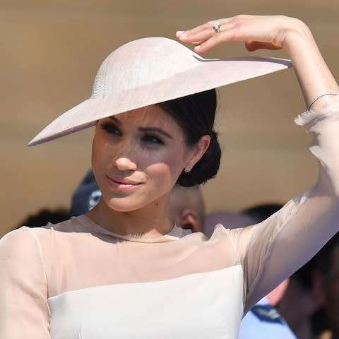 The Duchess of Sussex wore a neat chignon on her first royal engagement since marrying Prince Harry  - Credit:  Dominic Lipinski/Pool PA