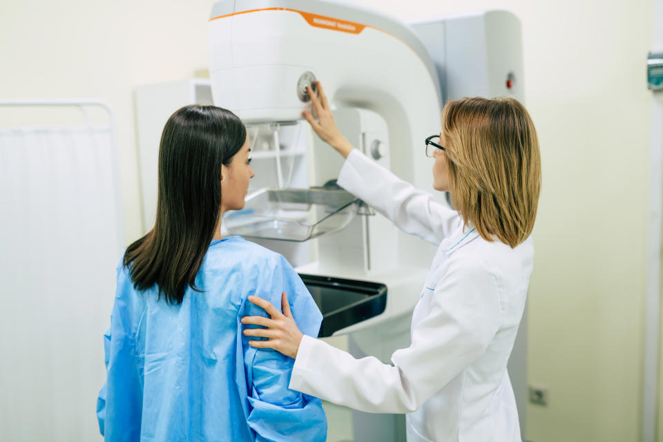 A woman receiving a mammography examination