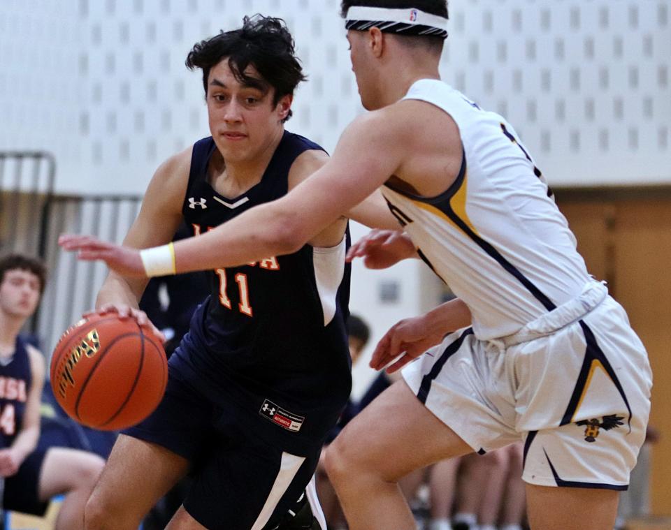 Advanced Math and Science Academy's Mateo Arellano drives to the basket during a preliminary round game in the Division 3 state tournament against Hanover on Tuesday, March 1, 2022.