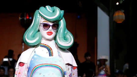 A model presents a creation by Indian designer Manish Arora as part of his Spring/Summer 2017 women's ready-to-wear collection during Fashion Week in Paris, France September 29, 2016. REUTERS/Gonzalo Fuentes