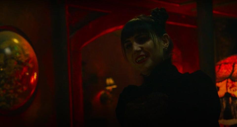 Nadja smiling in "What We Do in the Shadows"
