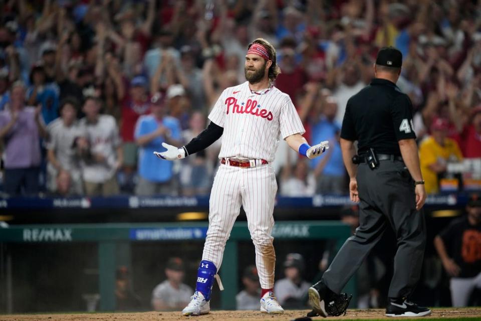 Philadelphia Phillies' Bryce Harper reacts after hitting an inside-the-park home run during a baseball game, Monday, Aug. 21, 2023, in Philadelphia. (AP Photo/Matt Slocum)