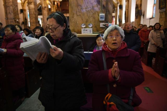 China's roughly 12 million Catholics are divided between a government-run association and an unofficial underground church loyal to the Vatican
