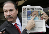 Attorney Howard Fensterman, representing the East Neck Nursing and Rehabilitation Center, points to a newspaper article about the nursing home during a news conference, Tuesday, April 8, 2014. in West Babylon, N.Y. The nursing home hired a male exotic dancer to perform for its patients, according to a lawsuit filed by facility resident Bernice Youngblood in State Supreme Court in Suffolk County. Fensterman acknowledged the home hired the dancer, but said that Youngblood's attendance was voluntary. (AP Photo/Mark Lennihan)