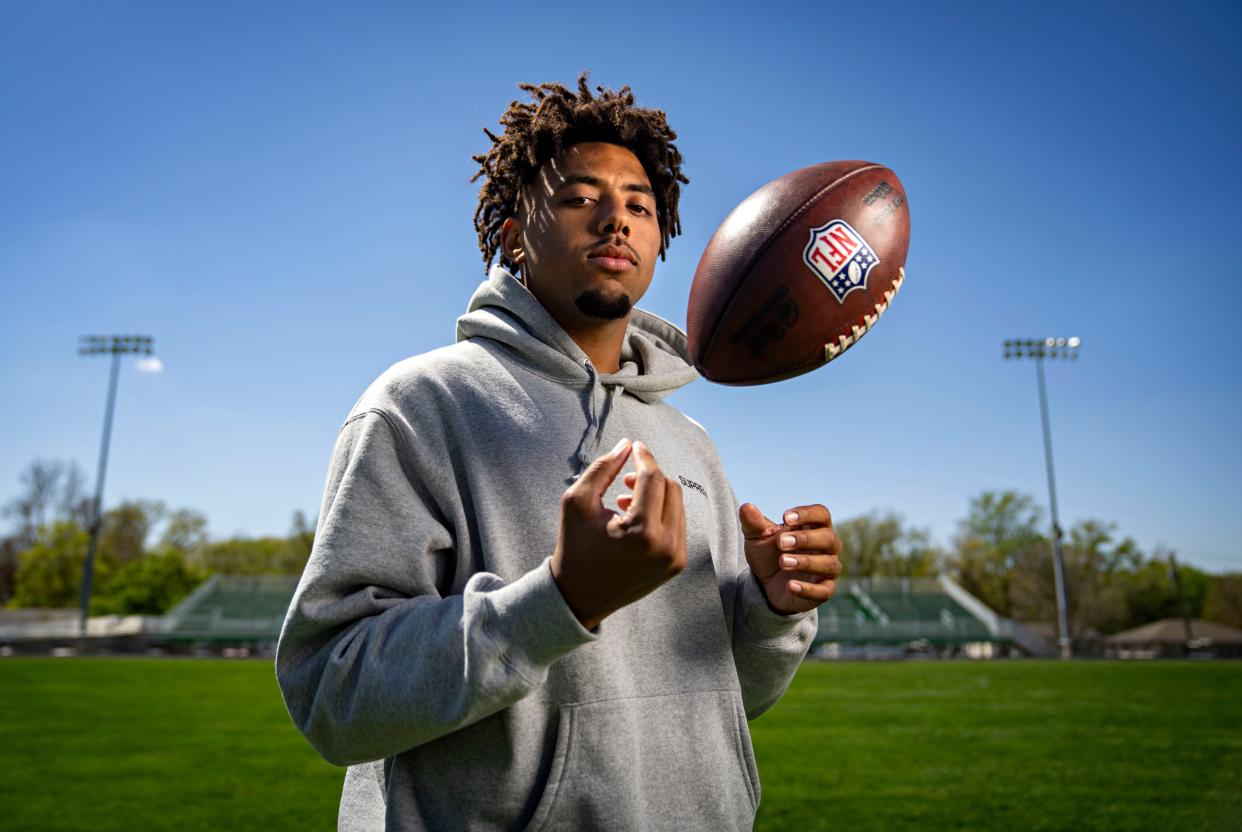 Byron Jarrett stands for a photo on the football field at Hoover High School, Tuesday, April 23, 2024.