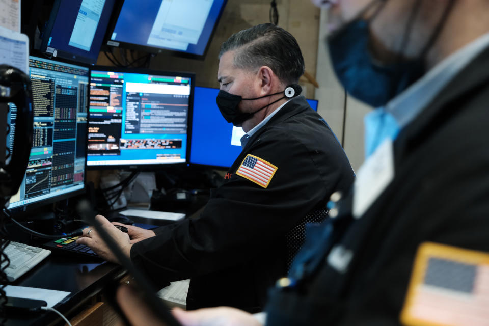 NEW YORK, NEW YORK - FEBRUARY 04: Traders work on the floor of the New York Stock Exchange (NYSE) on February 04, 2022 in New York City. Following a strong jobs report, stocks still slid in morning trading with the Dow Jones Industrial Average down over 60 points as volatility in tech markets unsettled investors. (Photo by Spencer Platt/Getty Images)