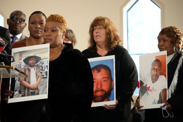 Mary Moore Glenn, mother of Marrio Moore, 40, left, Gretchen Hankins, mother of Jonathan Hankins, 39, center, and Bettersten Wade, mother of Dexter Wade, 37, hold photographs of their deceased sons during a news conference in Jackson, Mississippi on Dec. 20, 2023, where they expressed their sentiments regarding their sons being buried by authorities in unmarked graves in the Hinds County Pauper's Field in Raymond, without the families' knowledge for extended periods of time.