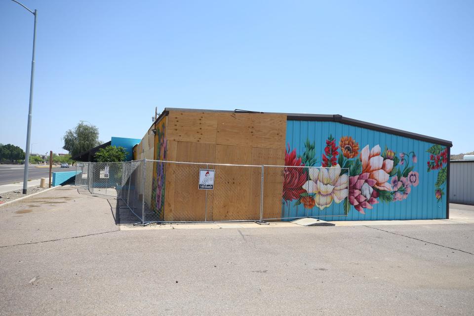 The damage to Baseline Flowers on Baseline Road in Phoenix, shown here on April 27, 2022, was caused by two vehicles that lost control and crashed into the building. Speed was a factor, Phoenix police say.