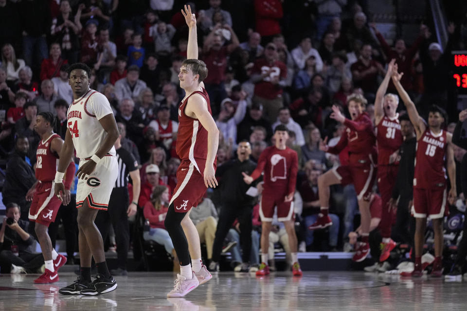 Alabama forward Grant Nelson (2) reacts after hitting a three-point basket late in the second half of an NCAA college basketball game against Georgia Wednesday, Jan. 31, 2024, in Athens, Ga. (AP Photo/John Bazemore)