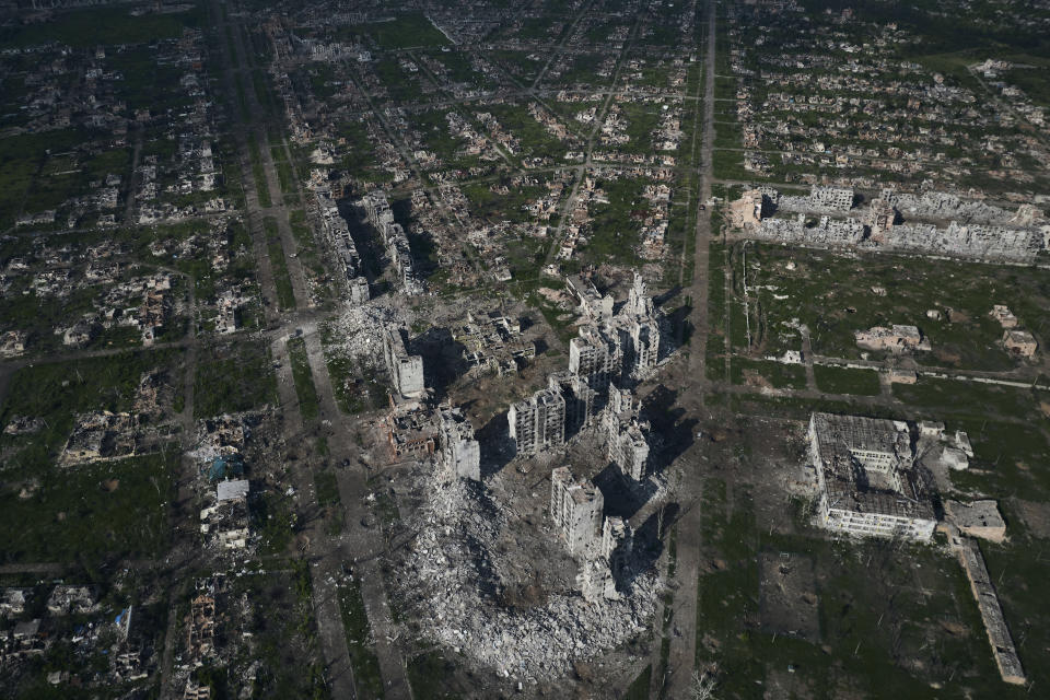 FILE - An aerial view of Bakhmut, the site of the heaviest battles with Russian troops in the Donetsk region, Ukraine, Thursday, June 22, 2023. Fighting has intensified at multiple points along the 1,500-kilometer (930-mile) front line. Ukrainian forces are making steady progress along the northern and southern flanks of Bakhmut, in a semi-encirclement of the wrecked city that Russian forces have been occupying since May. (AP Photo/Libkos, File)