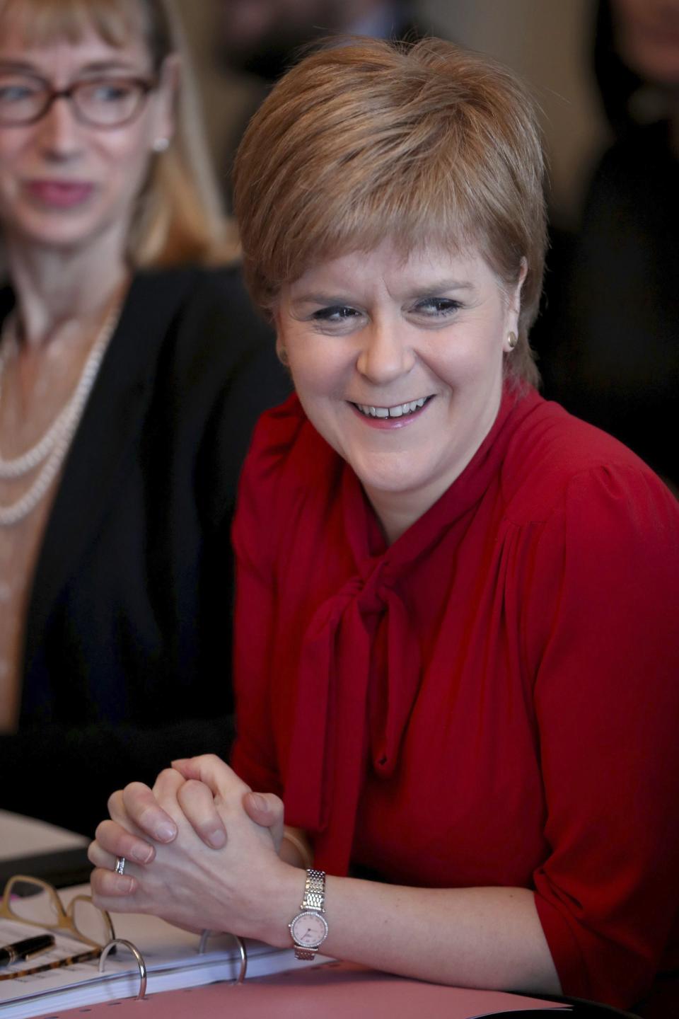 Scottish First Minister Nicola Sturgeon smiles during a Scottish Government cabinet meeting in Bute House, Edinburgh, Scotland Tuesday March 14, 2017. Sturgeon announced on Monday plans for a fresh referendum on Scottish independence before Britain finally leaves the EU. (Jane Barlow/PA via AP)