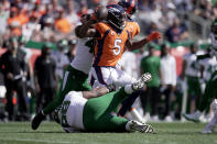 New York Jets defensive tackle Sheldon Rankins tackles Denver Broncos quarterback Teddy Bridgewater (5) during the first half of an NFL football game Sunday, Sept. 26, 2021, in Denver. (AP Photo/Jack Dempsey)