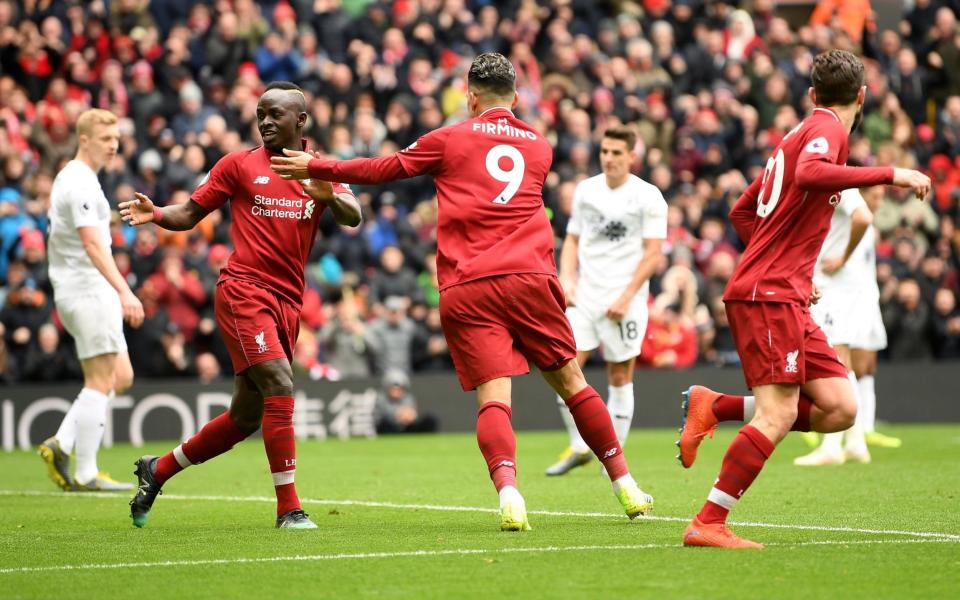 Roberto Firmino and Sadio Mane celebrate during Liverpool's 4-2 win over Burnley - Getty Images Europe