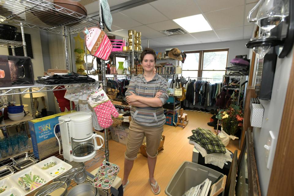 Savannah Kutkat stands in the thrift shop she opened in mid-July in East Peoria. Items at Enough Stuff Thrift Shop &amp; Community Space are not priced. Instead, customers can take them for free, make a donation, or sign up to be a part of a monthly subscription service that supports the shop.