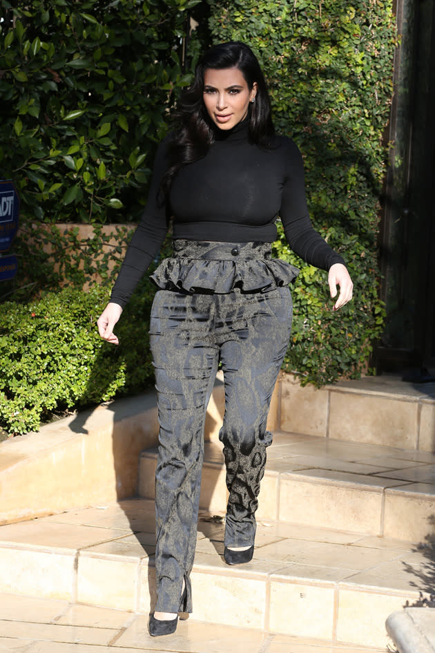 Kim Kardashian had a bit of a pregnancy fashion fail in these peplum high waisted trousers. Copyright [Splash]