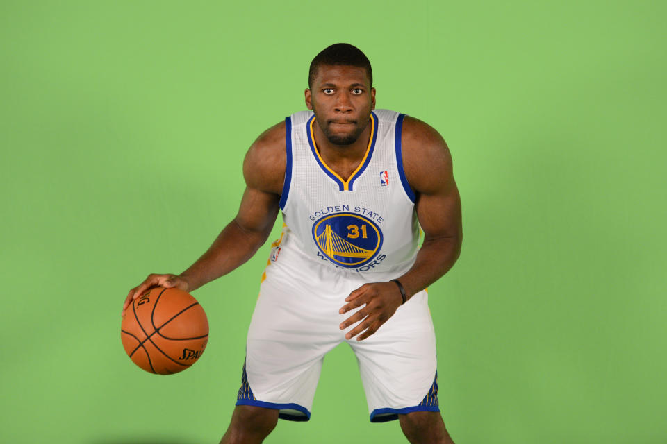September 27, 2013; Oakland, CA, USA; Golden State Warriors center Festus Ezeli (31) stands in front of a green screen during media day at the Warriors Practice Facility.