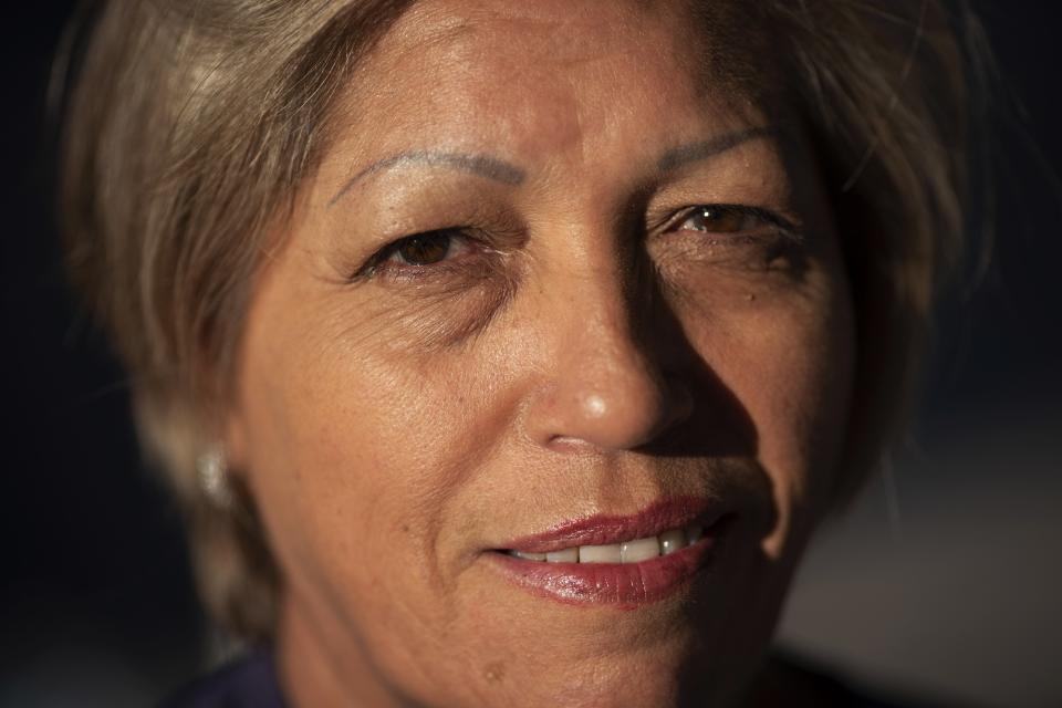 Norma Flores, 54, poses for a portrait in her home in Henderson, Nev., Tuesday, Nov. 10, 2020. Flores is a Mexican immigrant who spent two decades working as a waitress at the Fiesta before COVID-19 descended and she lost her job. (AP Photo/Wong Maye-E)