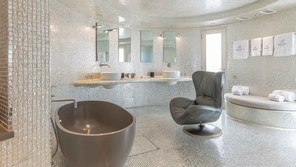 The spacious bathroom’s in the Rockstar villa don’t have heated floors, but they do have a leather recliner.