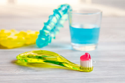 <span class="caption">By gum.</span> <span class="attribution"><a class="link " href="https://www.shutterstock.com/image-photo/childrens-toothbrush-oral-care-on-wooden-531569380?src=hM4YUFeOmzJ-4U5KeJOsxg-1-99" rel="nofollow noopener" target="_blank" data-ylk="slk:279Photo Studio;elm:context_link;itc:0;sec:content-canvas">279Photo Studio</a></span>