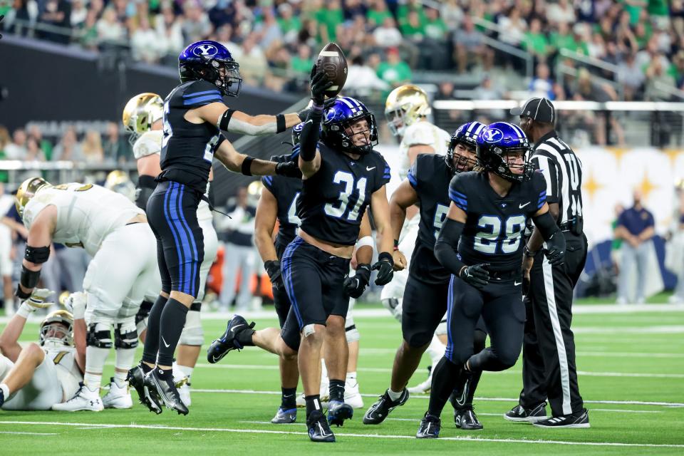 BYU linebacker Max Tooley (31) celebrates after intercepting a Notre Dame pass at Allegiant Stadium in Las Vegas on Saturday, Oct. 8, 2022. | Spenser Heaps, Deseret News