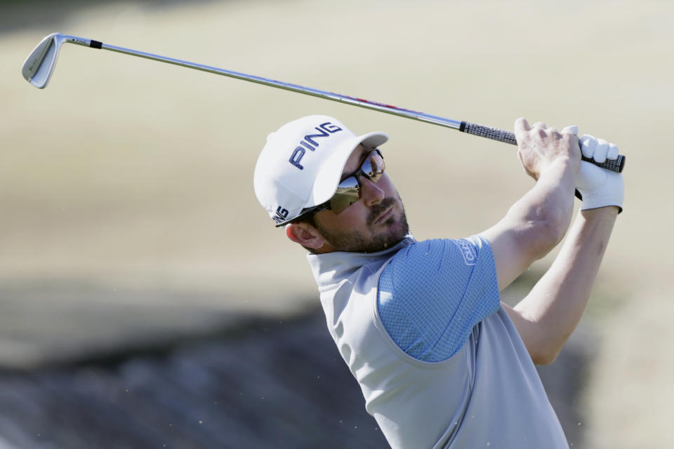 Andrew Landry follows through on the fourth tee during the final round of The American Express golf tournament on the Stadium Course at PGA West in La Quinta, Calif., Sunday, Jan. 19, 2020. (AP Photo/Alex Gallardo)